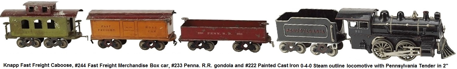 Knapp Fast Freight caboose, #244 Fast Freight Merchandise box car, #233 Penn. R.R. gondola and #222 painted cast iron steam outline 0-4-0 locomotive with 8 wheel Pennsylvania tender in 2-inch gauge