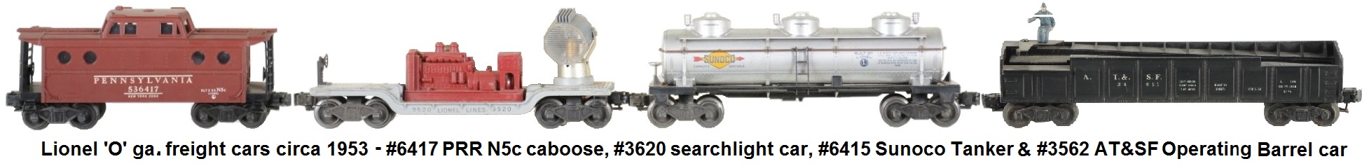Lionel 'O' gauge freight cars circa 1953 with #6417 PRR N5c caboose, #3620 operating searchlight car, #6415 Sunoco tank car, and #2562-1 Operating Barrel Car